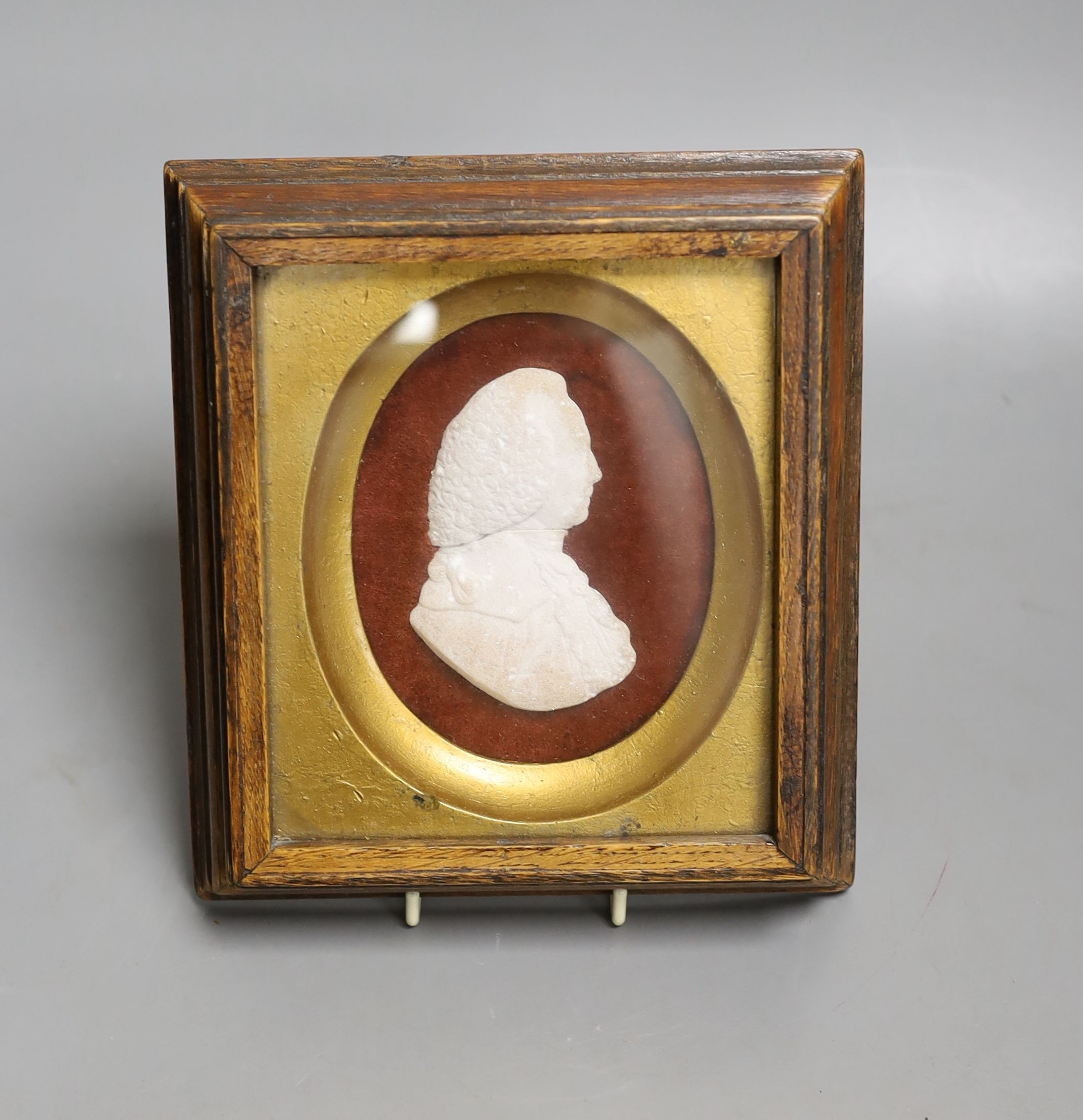 A crystalline stone relief portrait plaque of a gentleman, indistinctly signed, 8cm